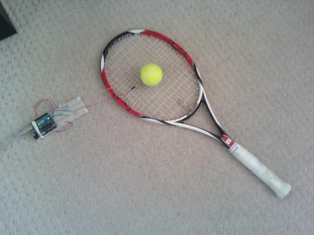 Tennis racquet and ball