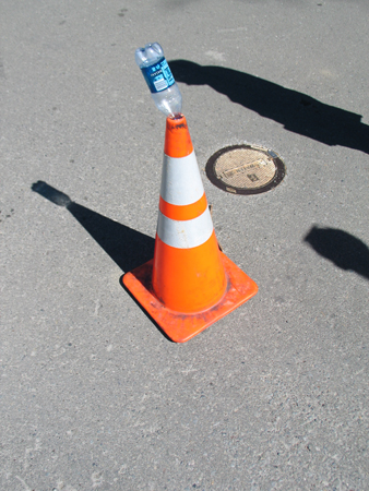 Road Cone used to Hold a Cast-Off Bottle
